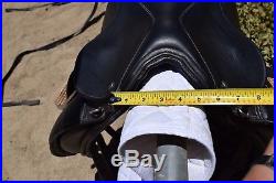 18 Collegiate dressage saddle. Includes leathers, irons, and 28 girth