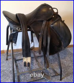 Black 18 inch Dressage Saddle With Padded Knee Rolls, Girth, Stirrups, & Leathers