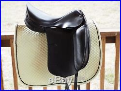 Black Dominus dressage saddle with leather girth, stirrups & stirrup leathers