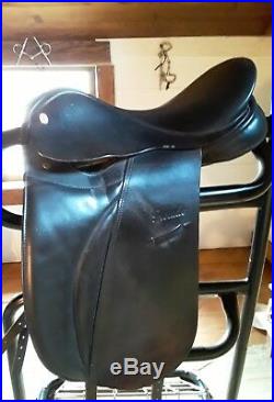 Rembrandt dressage saddle with girth, stirrup leathers and two saddle pads